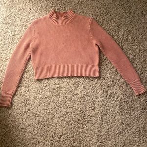 knitted pink turtleneck